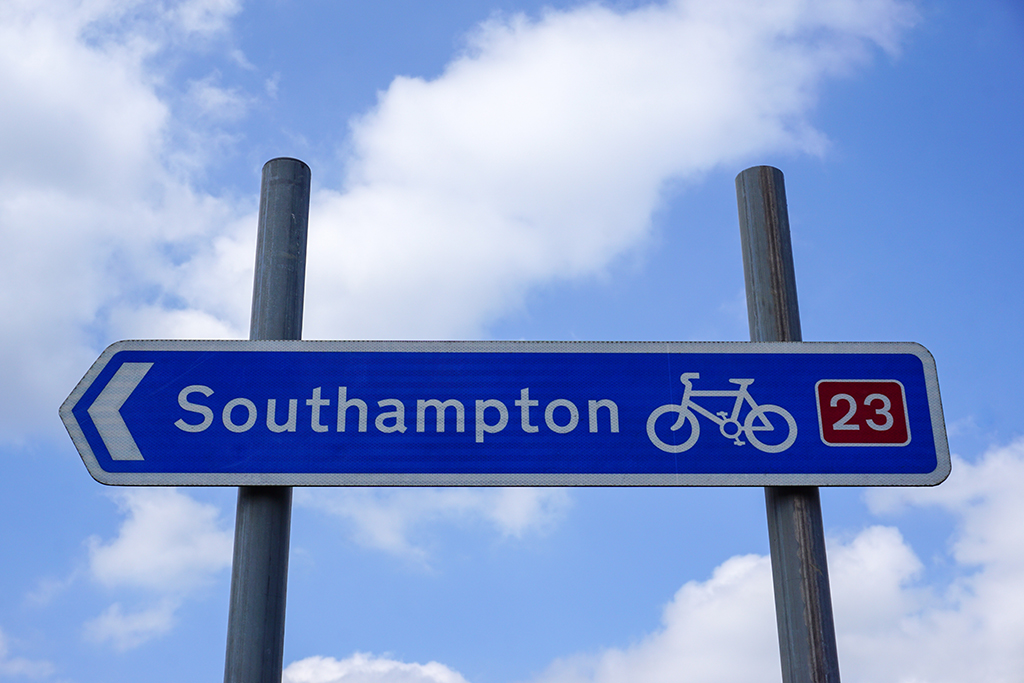 Road sign for cycle route to Southampton in the UK. arrow directional post on public cycle route