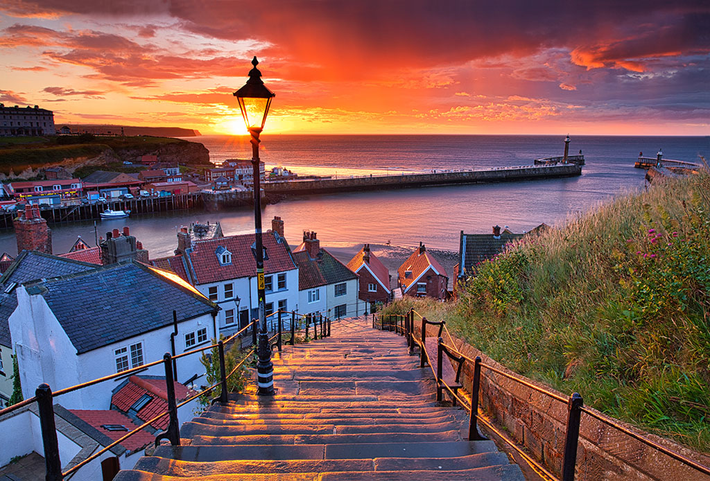 Dramatic Sunset at Whitby after a shower on a Summer Evening. North Yorkshire, England, UK.